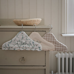 Children's Hanger in Secret Garden, Ivory and Beige Gingham hanging off top of  dresser