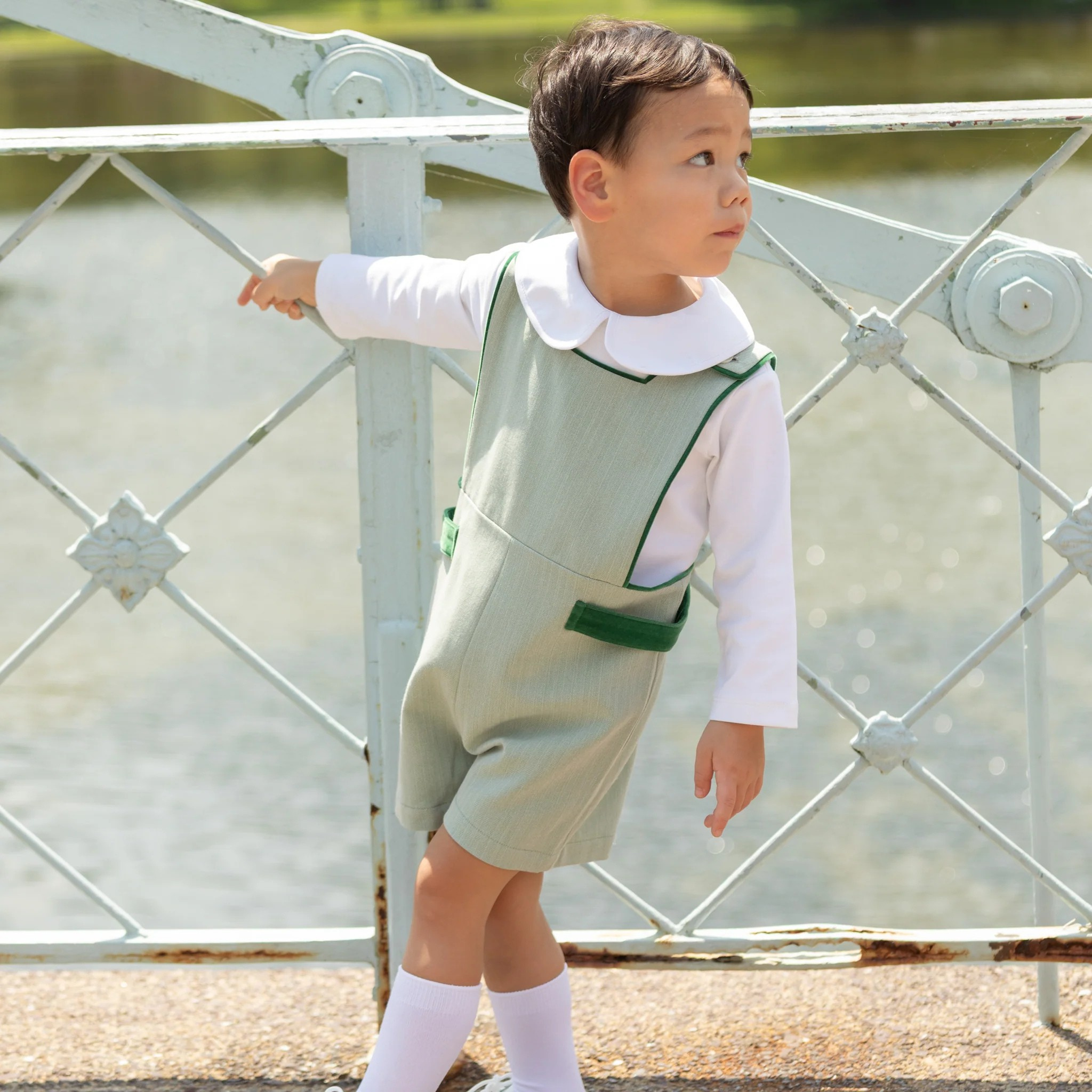 Henry Duvall classic baby boy jon jon in soft sage green herringbone, heirloom toddler outfit with shoulder buttons and stride snaps, inspired by English heritage style
