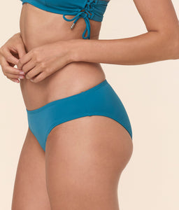 Close up of Andie Swim's Classic Bikini Bottom in Eco Nylon - Ocean, a low-rise swim bottom with medium seat coverage and a sculpting fit.