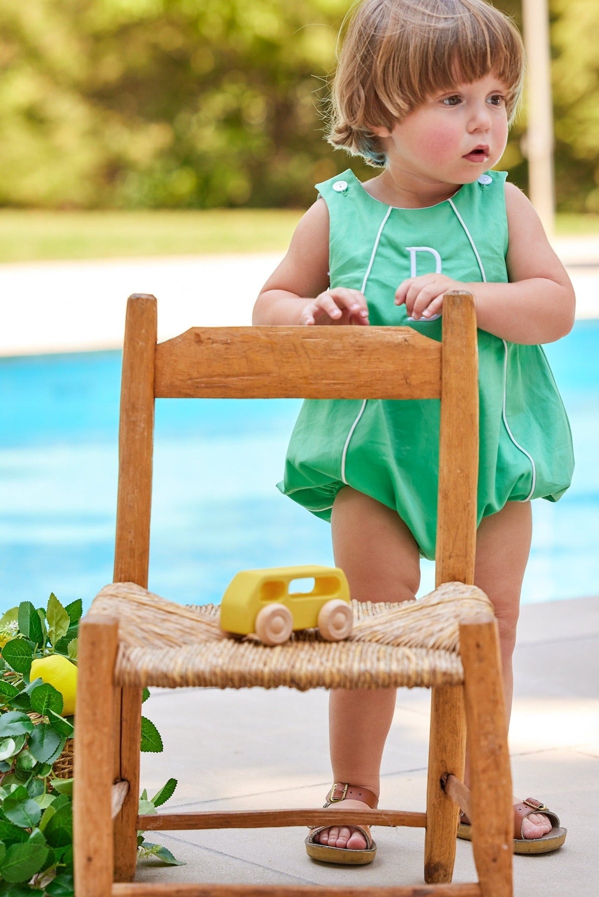 Little English traditional children's clothing. Green twill bubble with white piping for baby boy for Spring