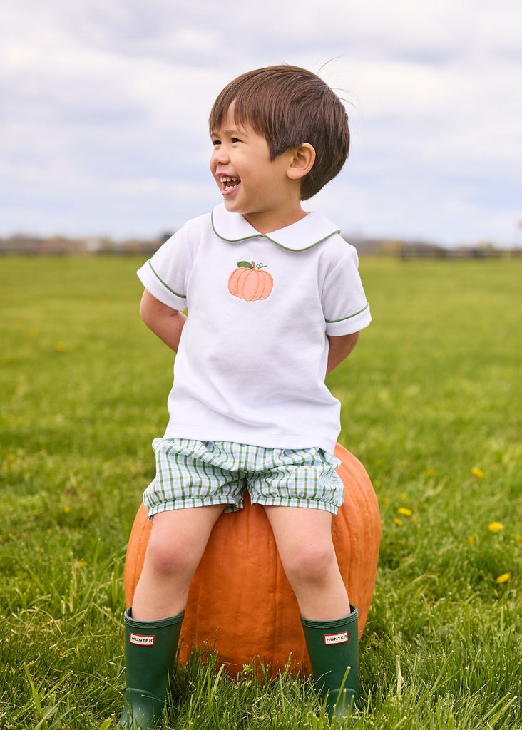 Little English classic short set for little boys.  White knit peter pan shirt with applique pumpkin at the center and coordinating banded shorts in green Leland Plaid.