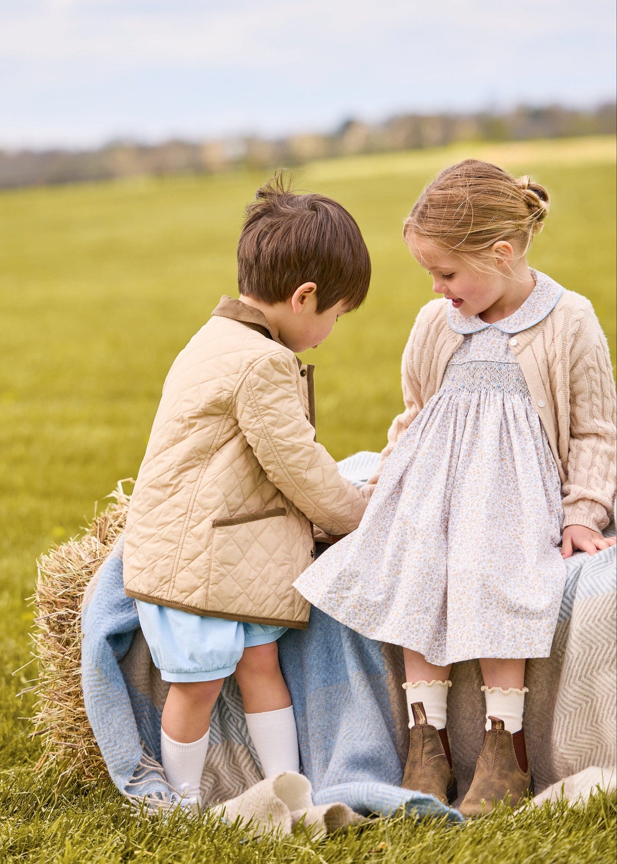 Little english classic childrens clothing, short set for boys in light blue and brown winthrop plaid with light blue corduroy shorts, Classic quilted jacket in khaki, Peter pan dress in winthrop floral print with smocking on chest, cashmere blend sweater in oatmeal, coordinating sibling outfits for fall