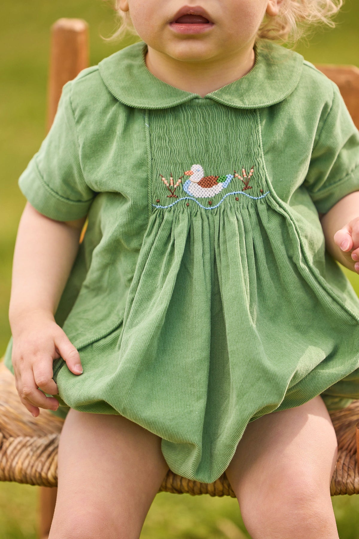 little english classic children's clothes, boys green corduroy bubble with peter pan collar and smocking on the chest with mallard motif