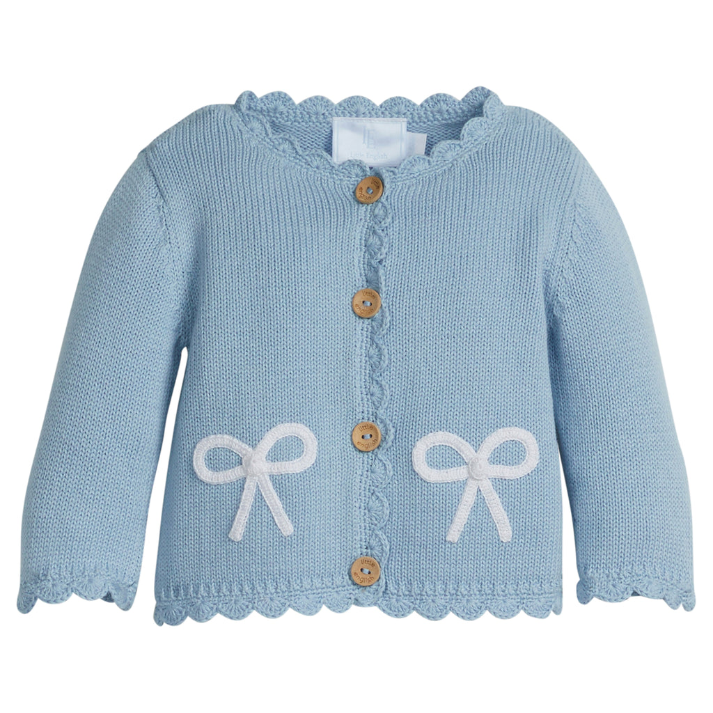 Little English traditional children's clothing. Baby girl's blue with white bow crochet cardigan sweater for Spring. Gift clothing for baby girl
