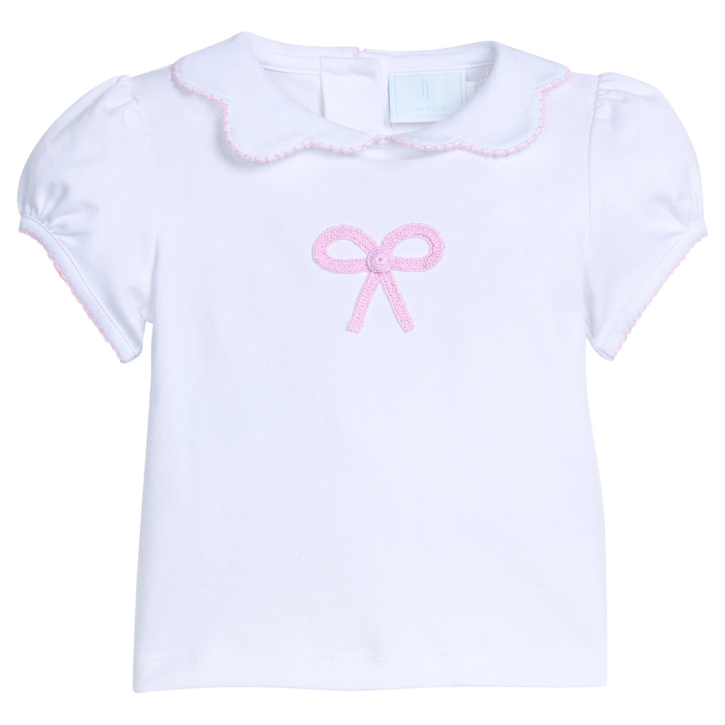Little English traditional children's clothing . White knit peter pan blouse with scallop collar and pink bow crochet for little girls. Gift clothing for baby girls