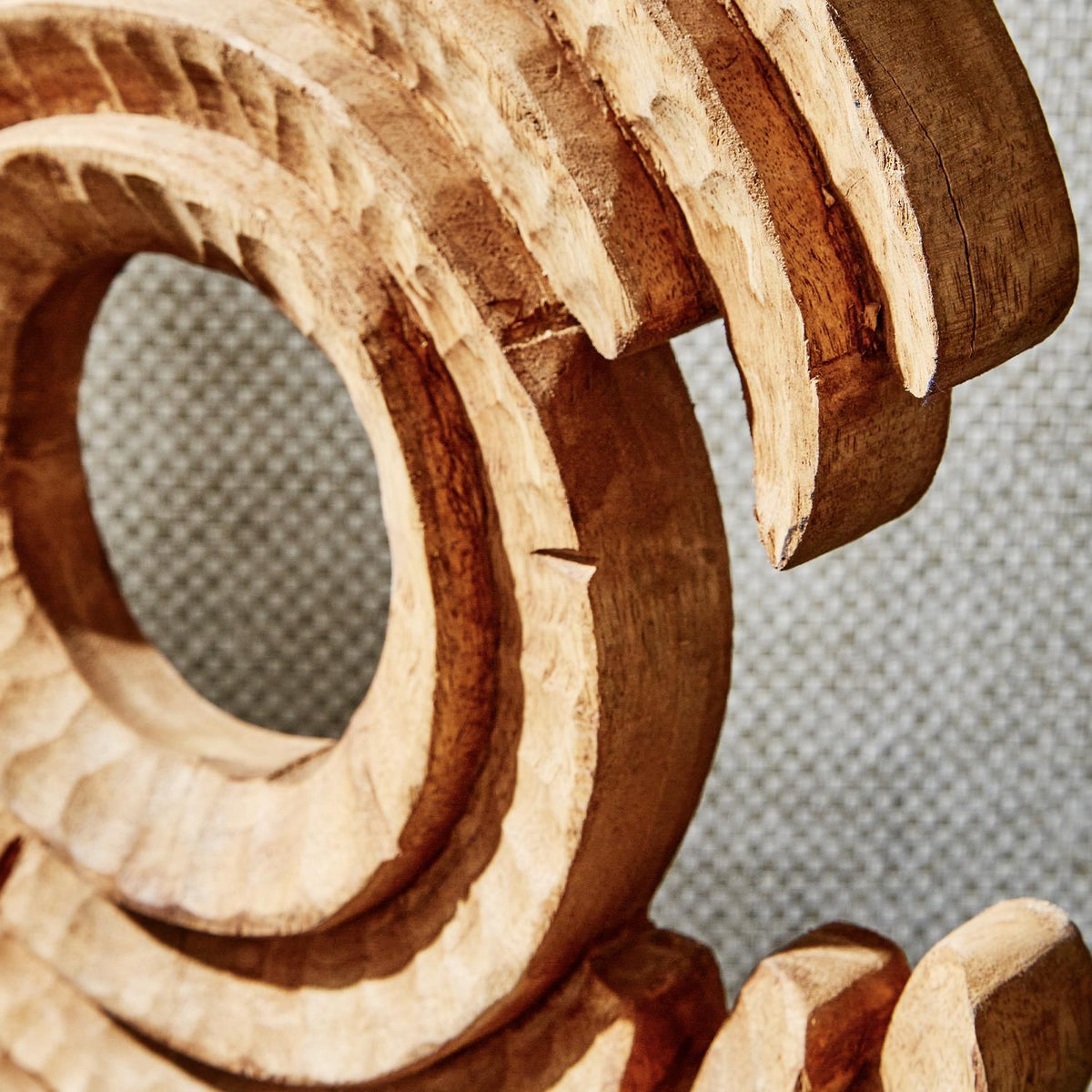 Hand-Carved Wood Sculpture on Black Stand