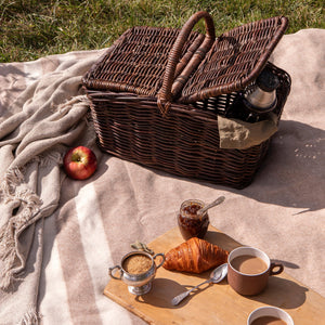woven picnic basket on blanket