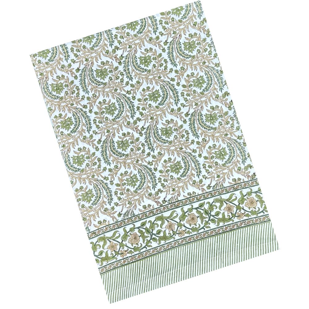 Green and tan hand block printed tablecloth with autumn colors and flowers and leaves.