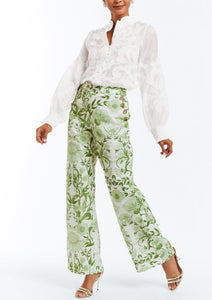Linen blouse with full length bishop sleeves, functional buttons, and embroidered flourishes.