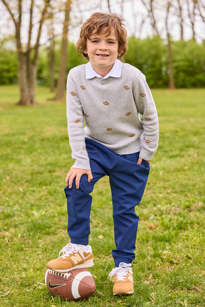 little english classic children's clothing, intarsia sweater with multi football motif, long sleeve polo in white, sport pant in navy