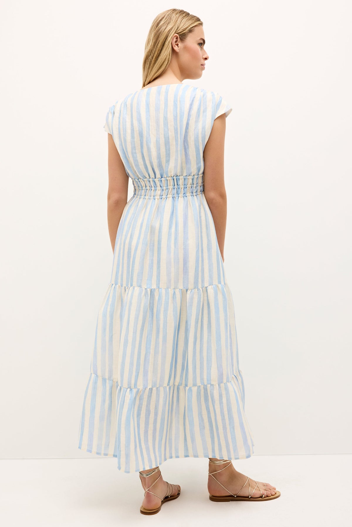 Casual summer dress with soft stripes, gathered waist tie, and flared hemline