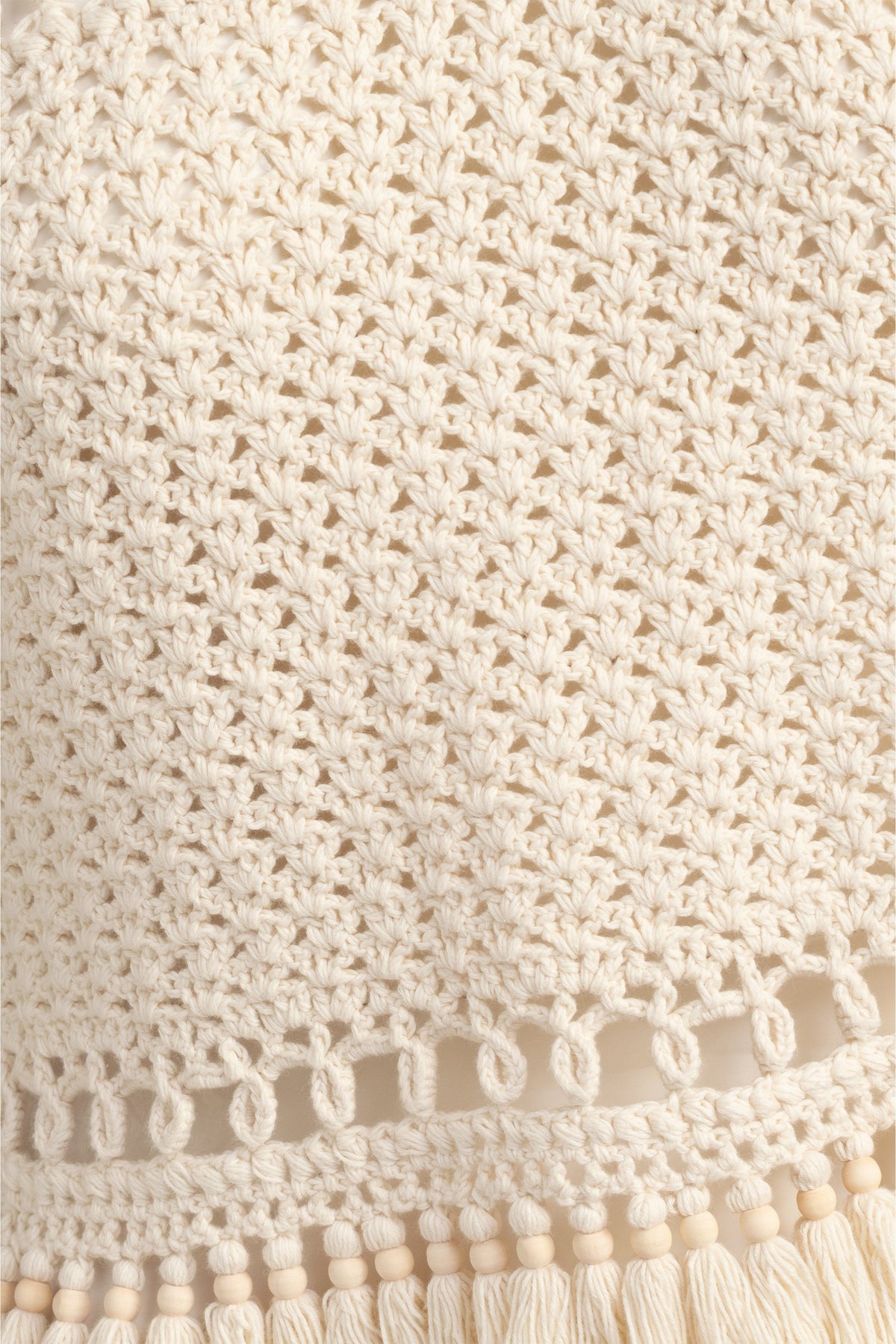 Summer ready crochet tank in neutral tone  with playful fringe finish
