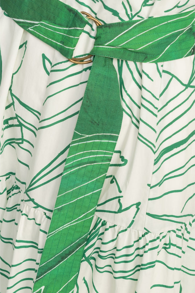 Green on white leaf print dress with a cinched waist and relaxed waist