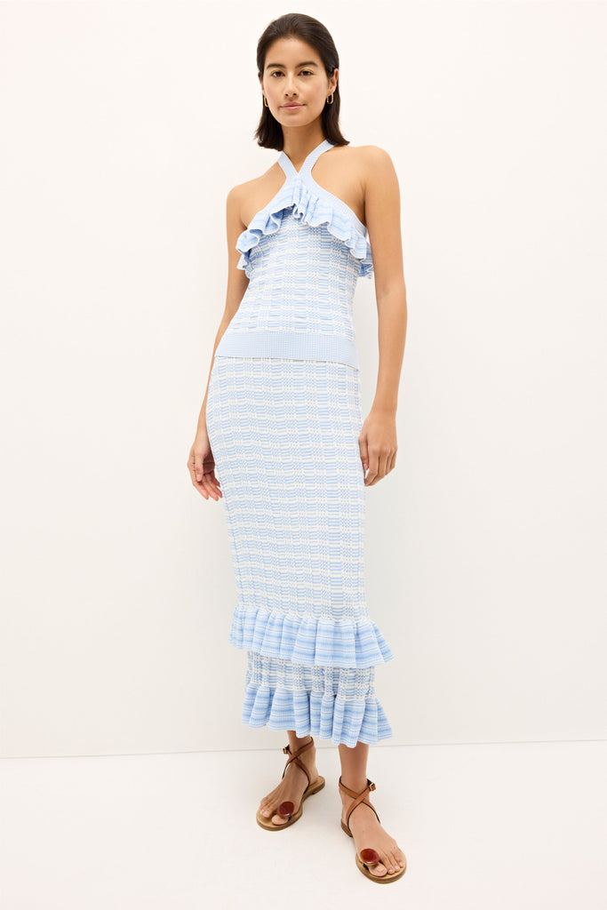 Knit top with ruffle trim and crossover halter design