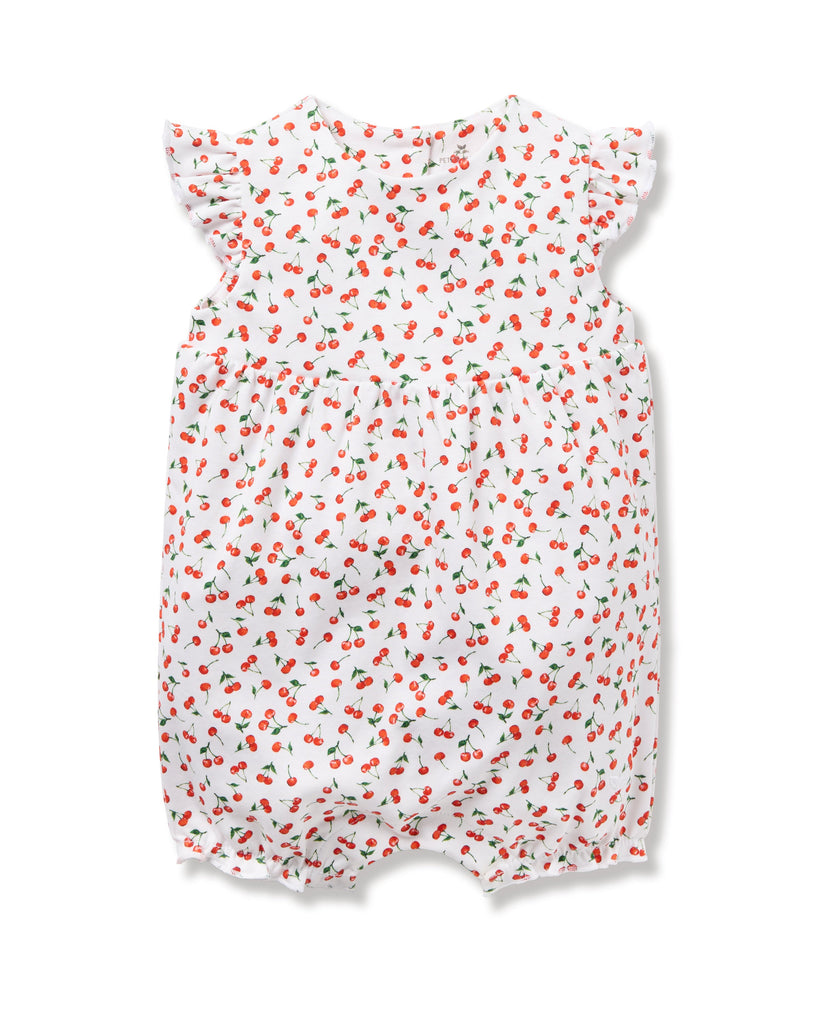 The Babys Pima Isla Play Romper in Cherry Orchard by Petite Plume is made from soft Pima cotton featuring short, ruffled sleeves and elastic leg openings. The cherry print with green leaves adds a playful touch, perfect for mom-and-me dressing.