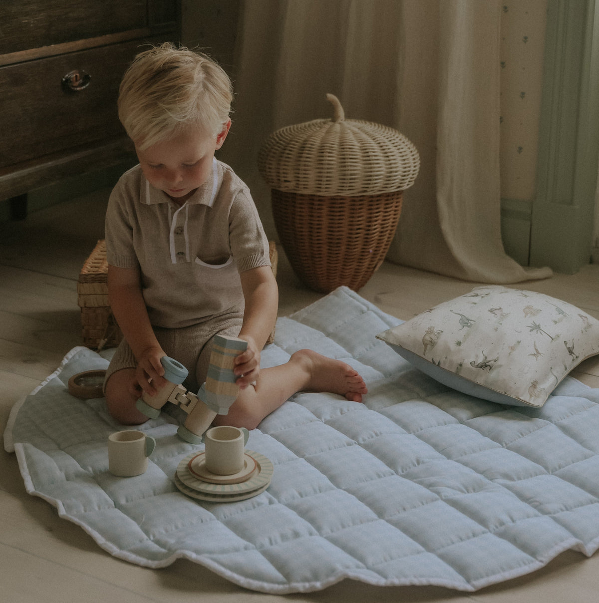 Picnic Gingham Play Mat in Blue with toddler playing on top with toys