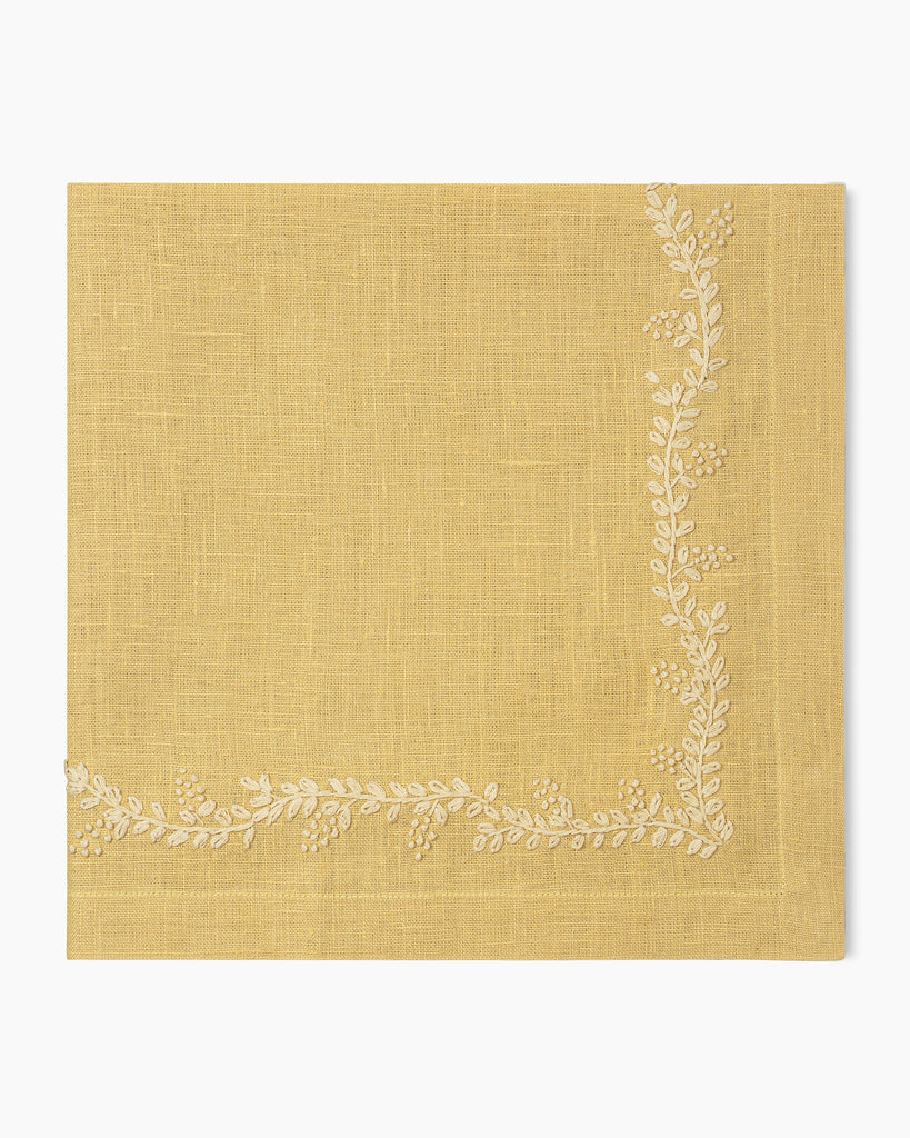 A Prism Vine Linen Dinner Napkin in 13 Colors by Henry Handwork with white embroidery, perfect for table linens.