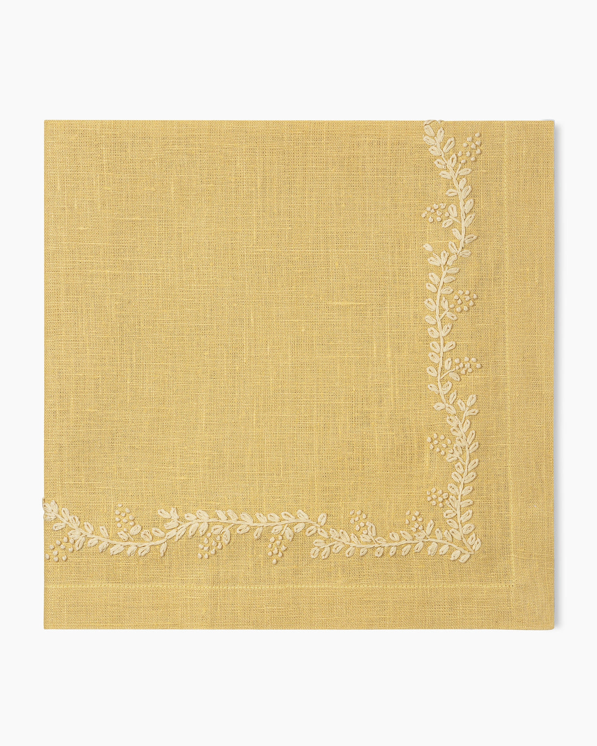 A Prism Vine Linen Dinner Napkin in 13 Colors by Henry Handwork with white embroidery, perfect for table linens.