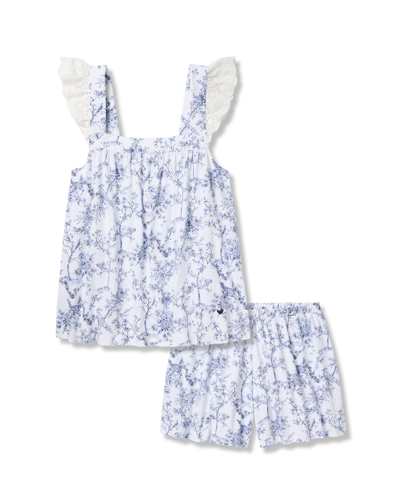 The Womens Pima Clara Short Set by Petite Plume exudes botanical elegance with a blue floral pattern on white. Featuring lace frilled shoulder straps, this sleeveless top and shorts set is perfect for any occasion.