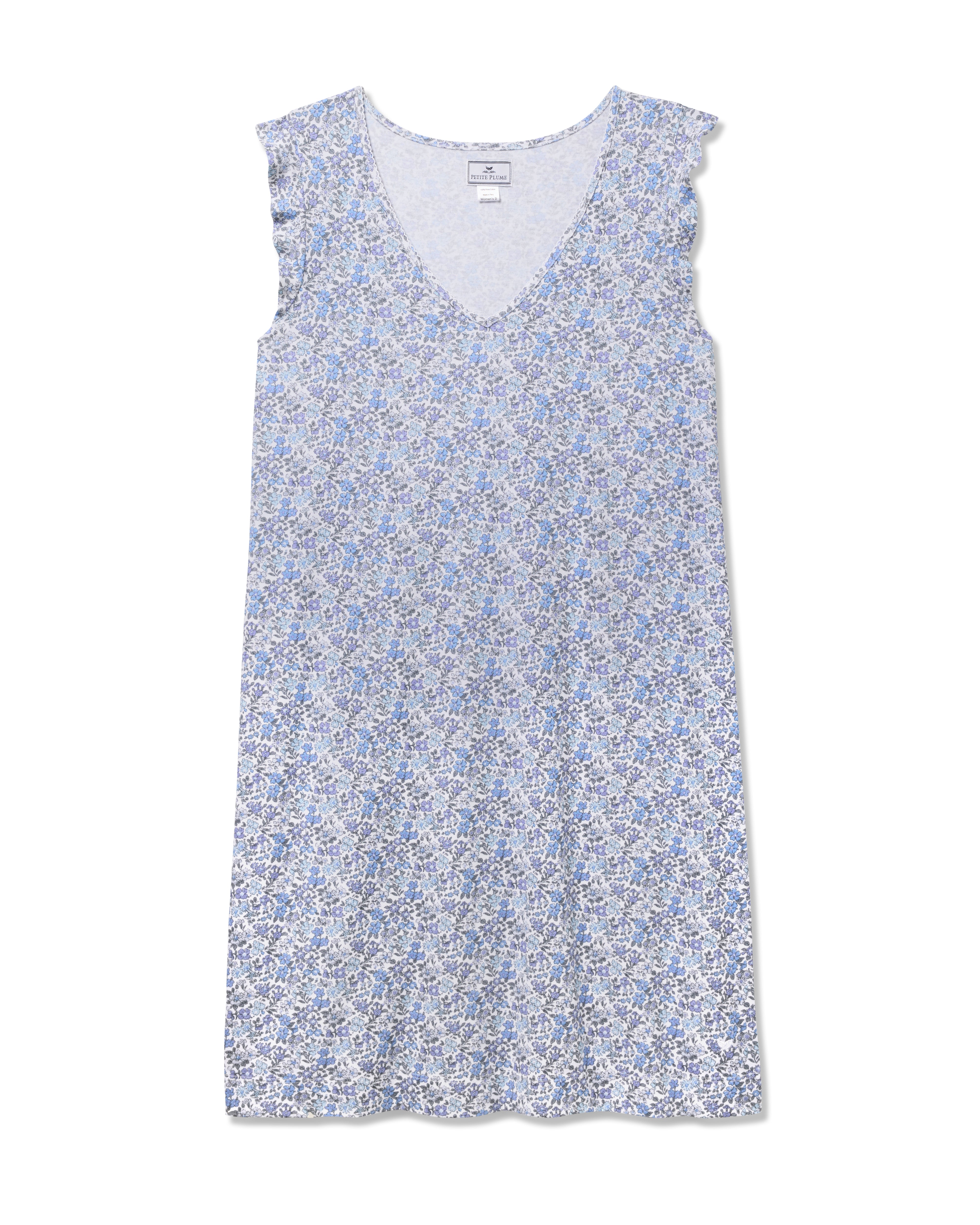 The Womens Pima Harper Nightgown in Fleur dAzur by Petite Plume features a vintage-inspired blue and white floral print. With its V-neckline and soft, flowy fabric, this piece combines casual comfort with timeless charm.