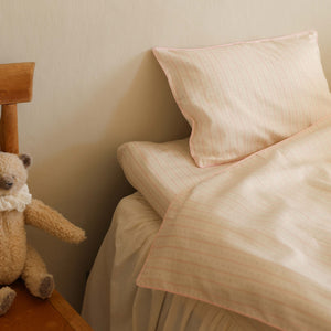 Petal Scallops Toddler Duvet in Pink displayed in children's room on bed