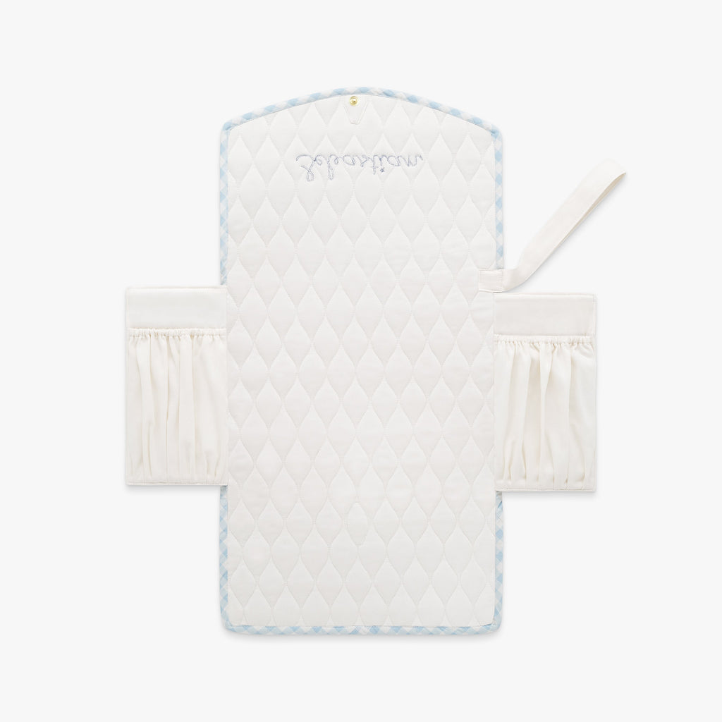 Portable Changing Pad in Blue Gingham. Inside is Ivory with pocket detail