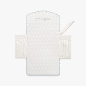 Portable Changing Pad in Blue Gingham. Inside is Ivory with pocket detail