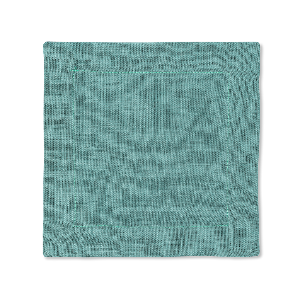 A square linen cocktail napkin in the color marine