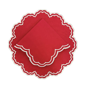Red scalloped placemat with white embroidery and matching napkin