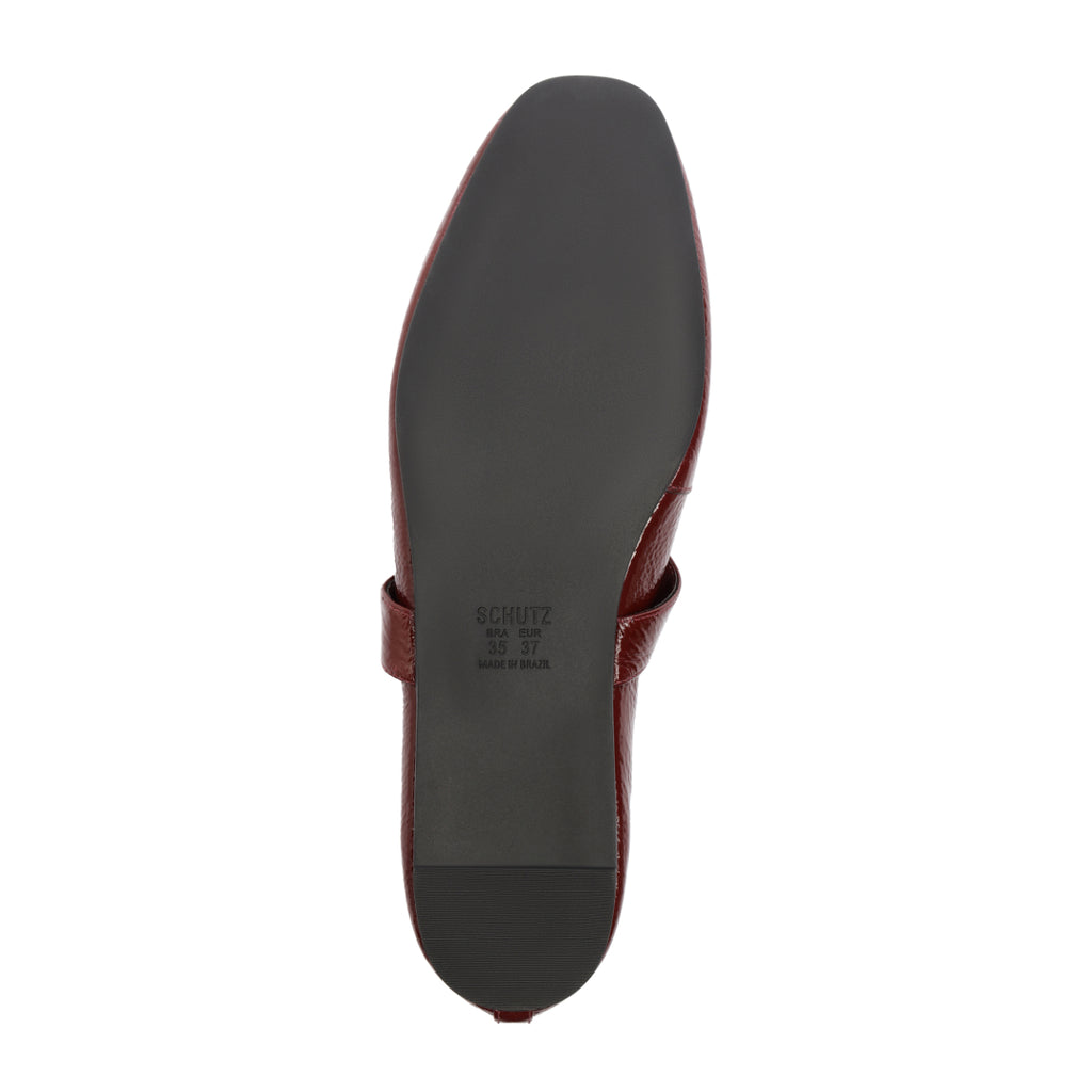 Courtney Buckle Patent Flat in Vino