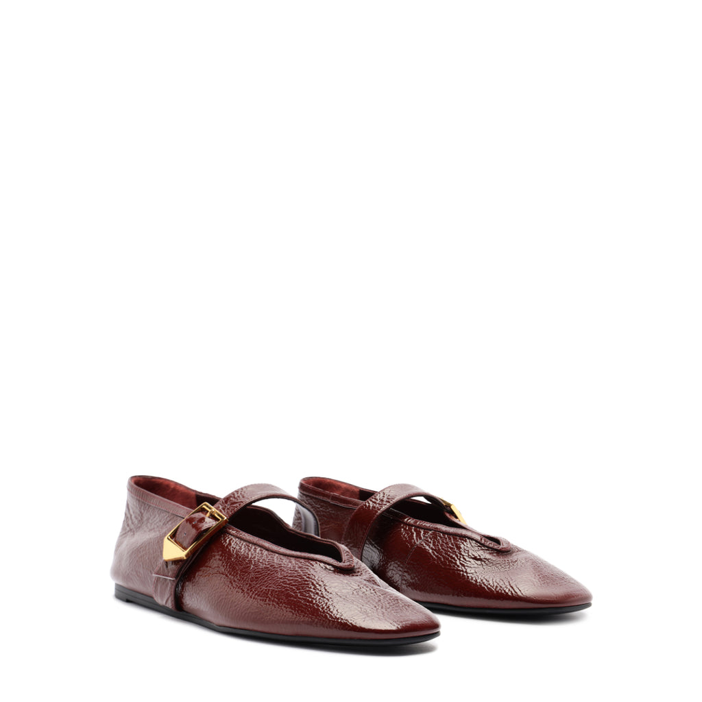 Courtney Buckle Patent Flat in Vino