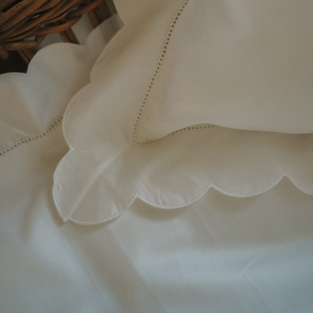 Scalloped Starlight Toddler Pillowcase in White corner detail of scallop and embroidery