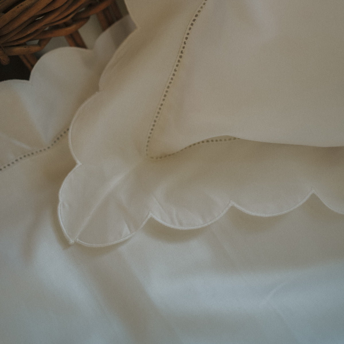 Scalloped Starlight Toddler Pillowcase in White corner detail of scallop and embroidery