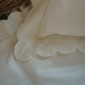 Scalloped Starlight Toddler Pillowcase in White corner detail of scallop and embroidery