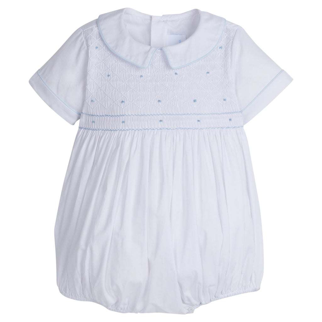 Little English traditional children's clothing. Dressy white bubble with smocking and blue dot embroidery for baby boys for Spring. Special occasion outfit for baby boy