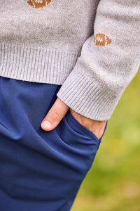 little english classic children's clothing, intarsia sweater with multi football motif, long sleeve polo in white, sport pant in navy