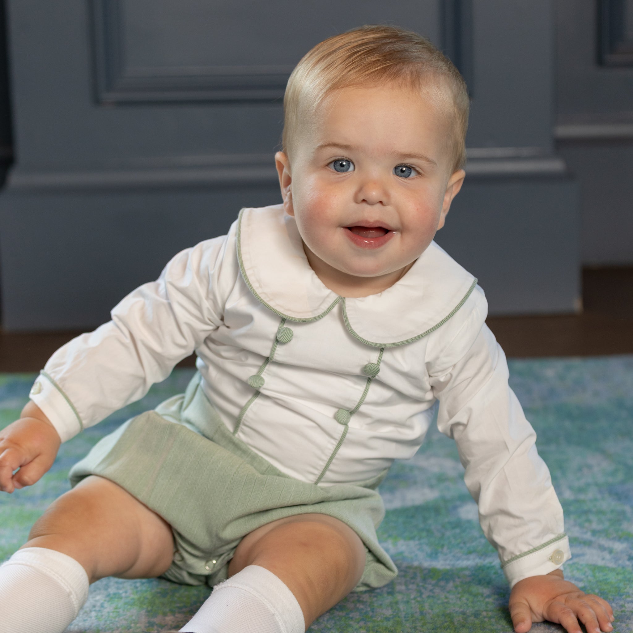 Classic baby boy bubble romper in sage green herringbone fabric, inspired by English heritage style, heirloom-quality traditional boys clothing for portraits, holidays, and special occasions