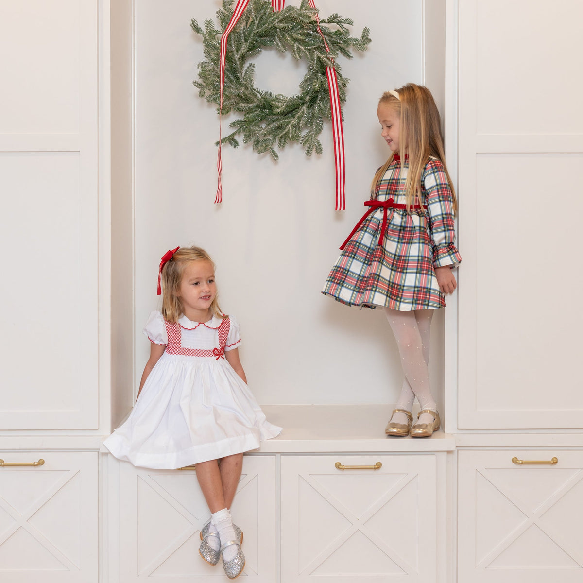 Girl's plaid holiday dress in Townsend Tartan with bow waist detail, vintage-inspired fit, perfect for family photos and festive gatherings – Henry Duvall classic
