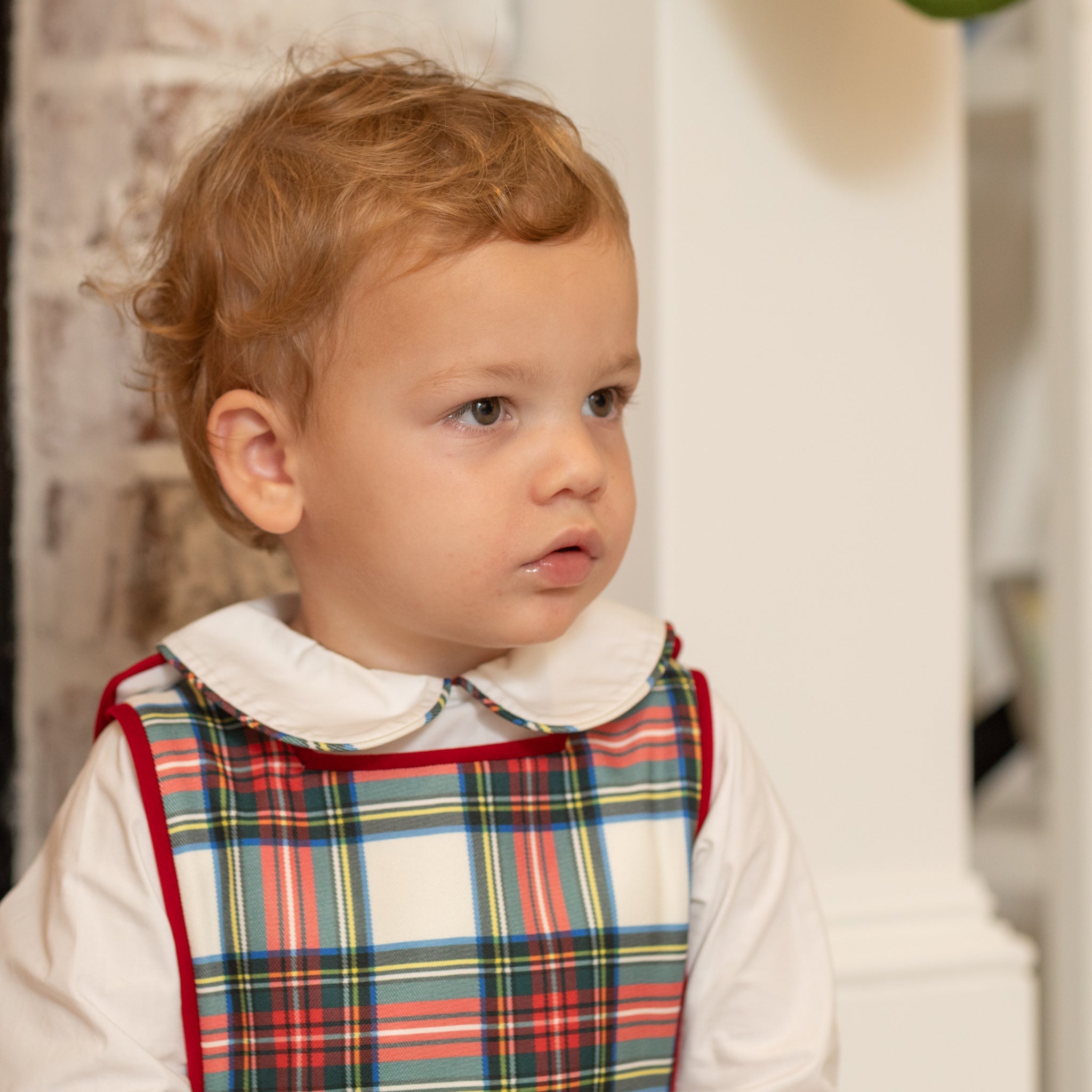 Classic white Peter Pan collar top highlighted with bold Townsend Tartan trim. A signature holiday piece from Henry Duvall’s Holiday Collection.