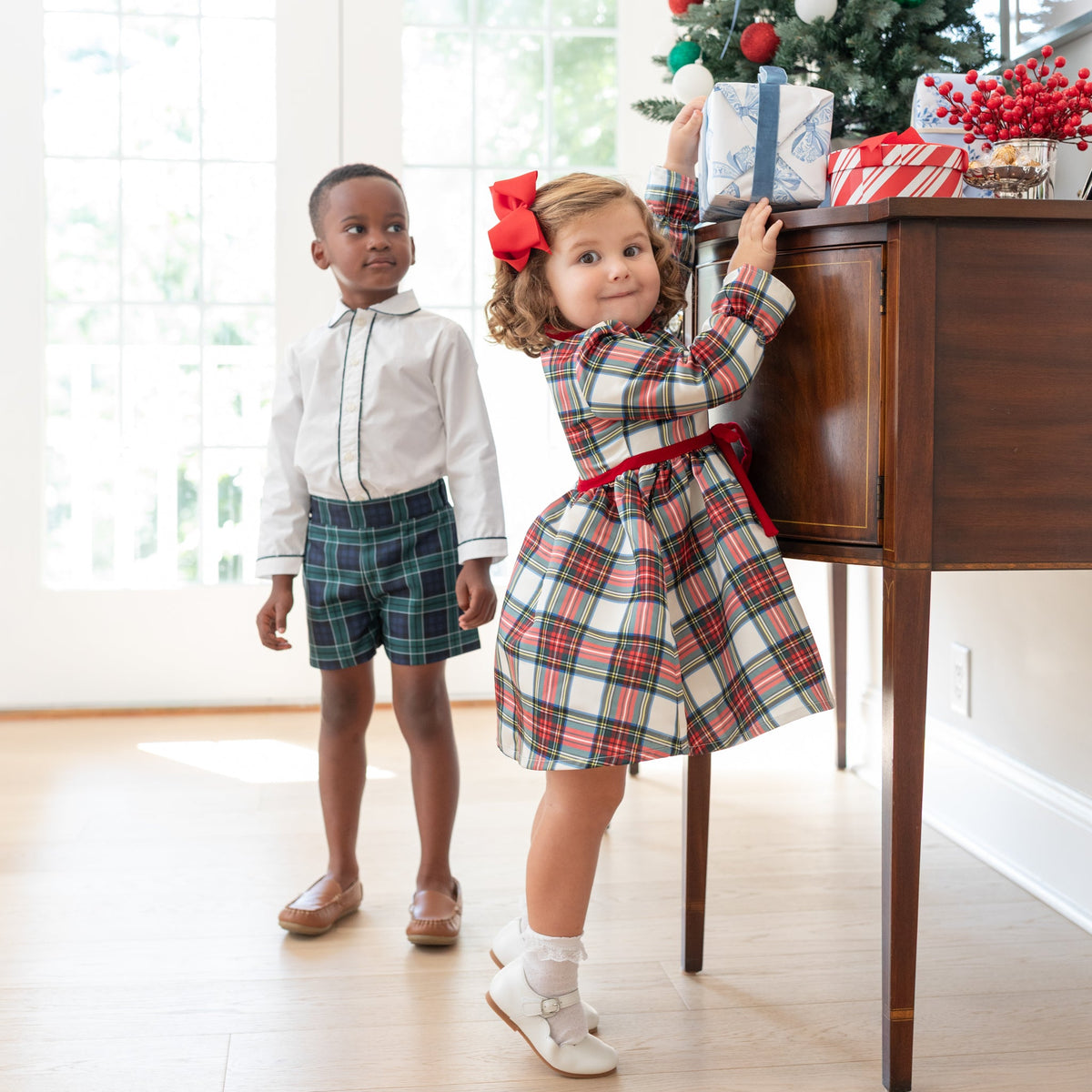 Girl's plaid holiday dress in Townsend Tartan with bow waist detail, vintage-inspired fit, perfect for family photos and festive gatherings – Henry Duvall classic
