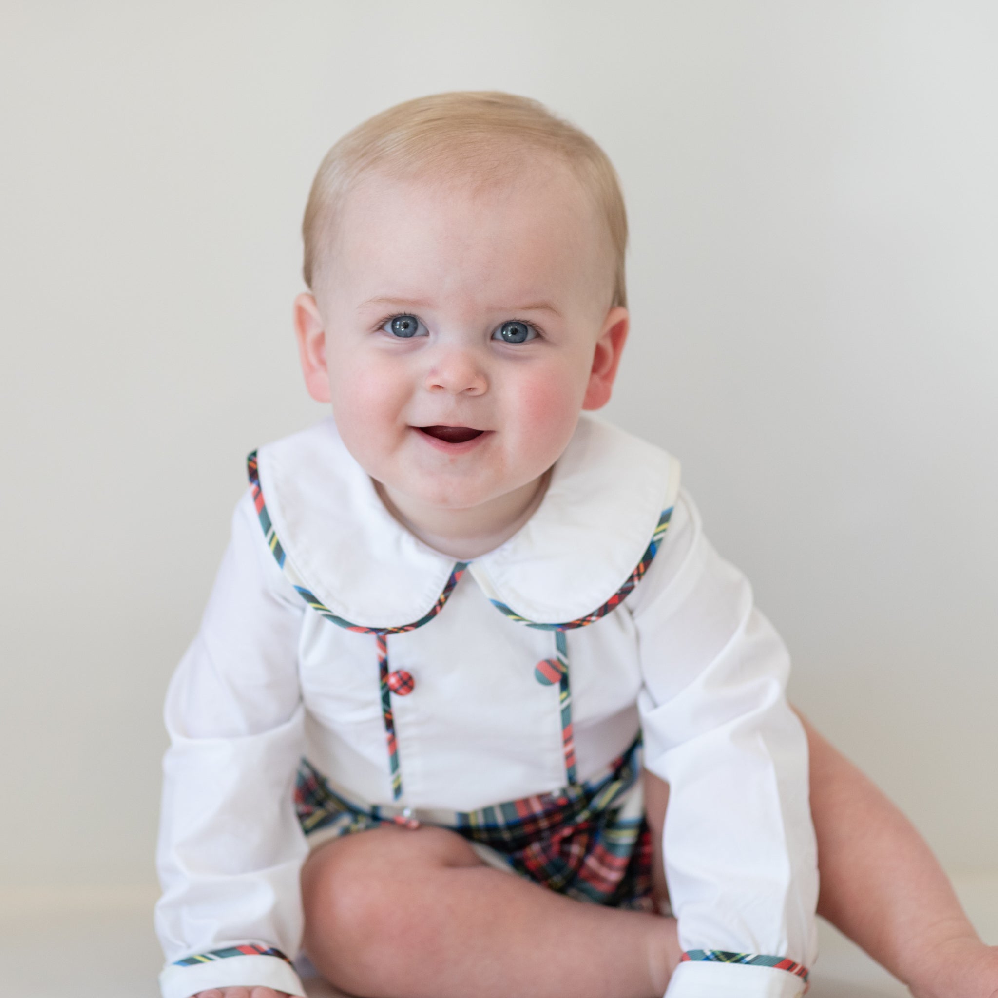 Classic baby boy bubble in traditional red Townsend Tartan with long white sleeves, boy holiday outfit with plaid for family photos