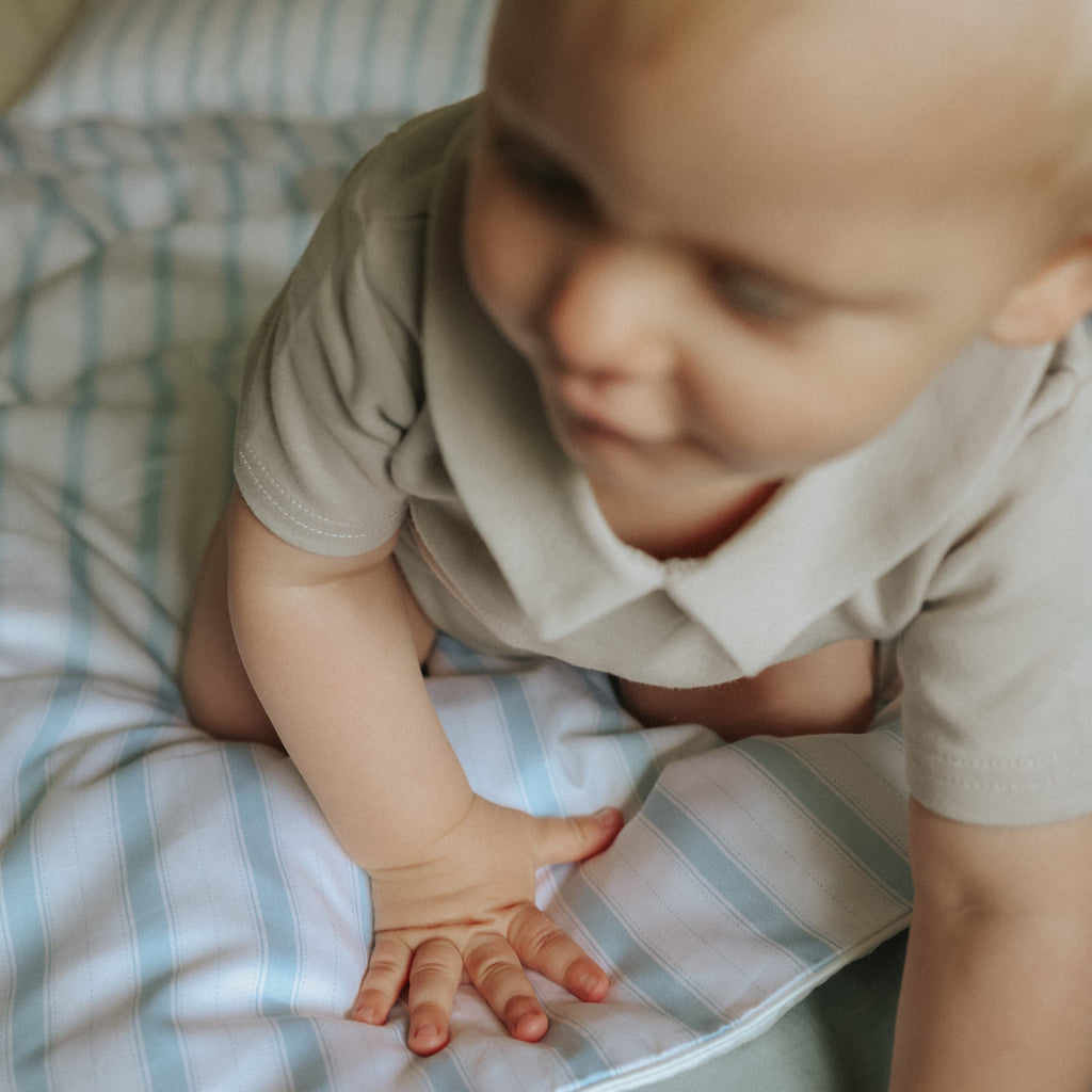 Baby on top of Baby Duvet in the Coastal Print in the color Blue