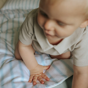 Baby on top of Baby Duvet in the Coastal Print in the color Blue