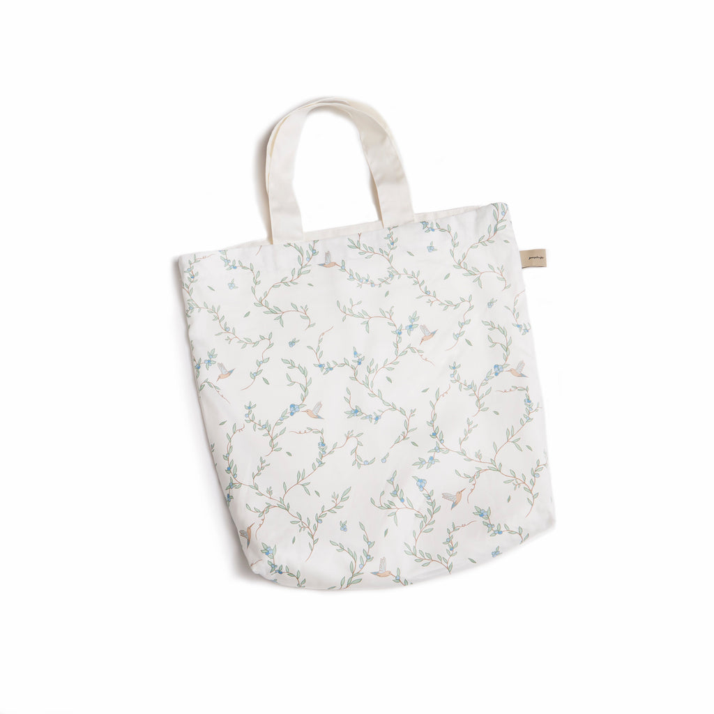 Tote Bag in Secret Garden print in Ivory . Tote bag is included with Play Mat.