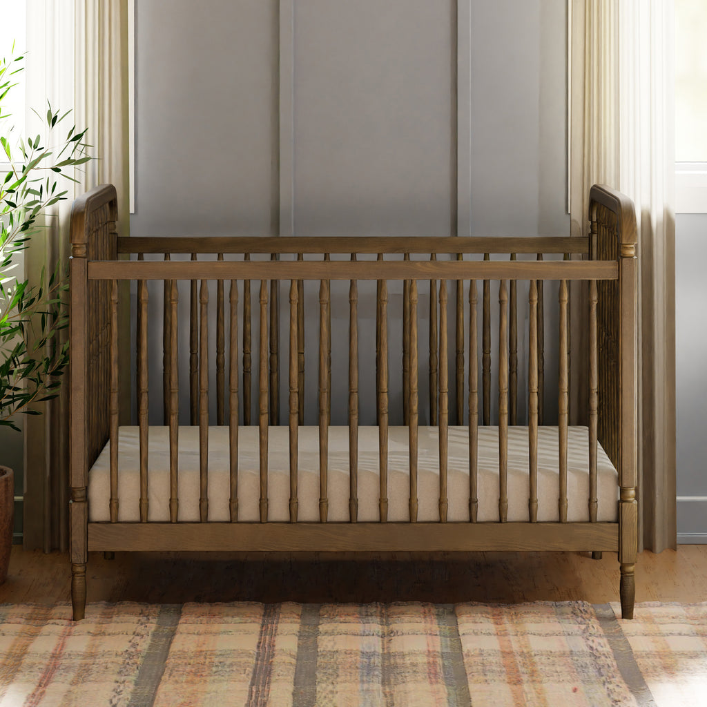 Liberty 3-in-1 Convertible Spindle Crib with Toddler Bed Conversion Kit in Natural Walnut