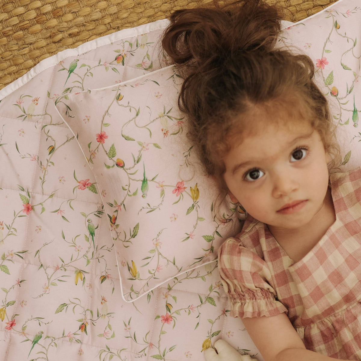 Dreaming of Paradise Toddler Pillow  with little girl laying cozy in bed