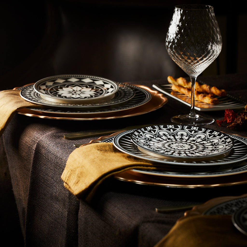 Phoebe clear universal wine glass, tulip shaped mouth blown optic crystal from Caskata paired with our Geometrics black and white porcelain collection.