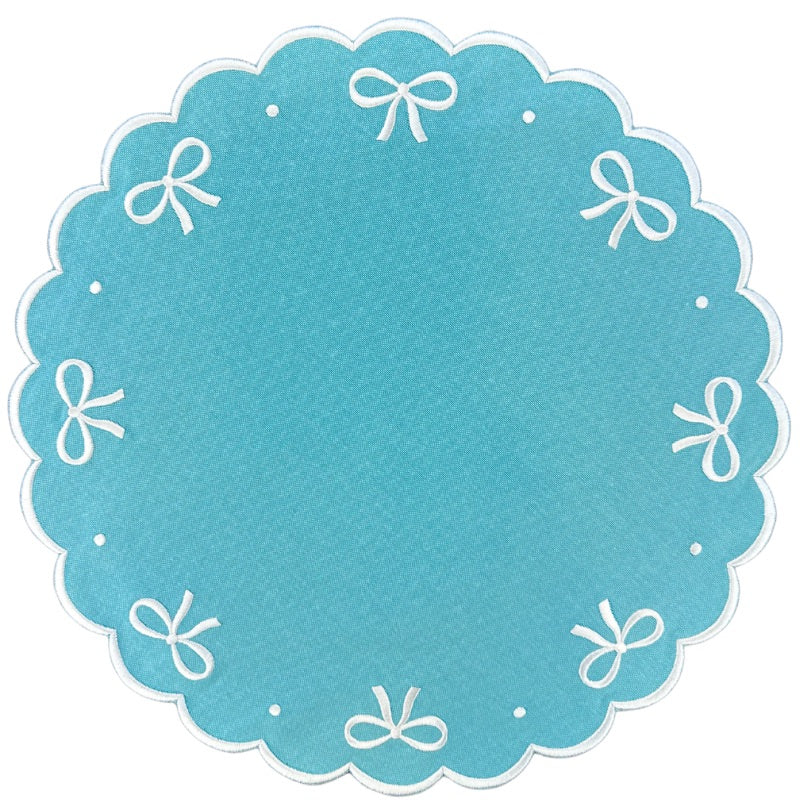 Embroidered robin egg blue placemat with bows, luxury placemat, by Flying Sheep Country.