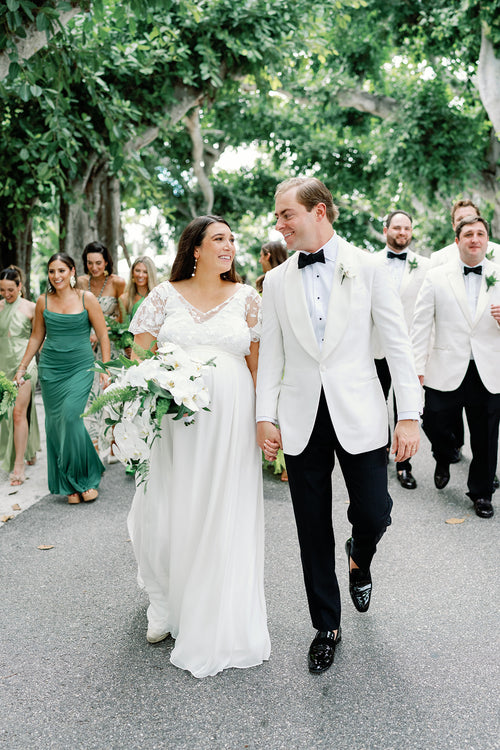 This Bride Showed Off Her Baby Bump Down The Aisle Nearly a Year After Their Venue Was Wrecked by Hurricane Ian