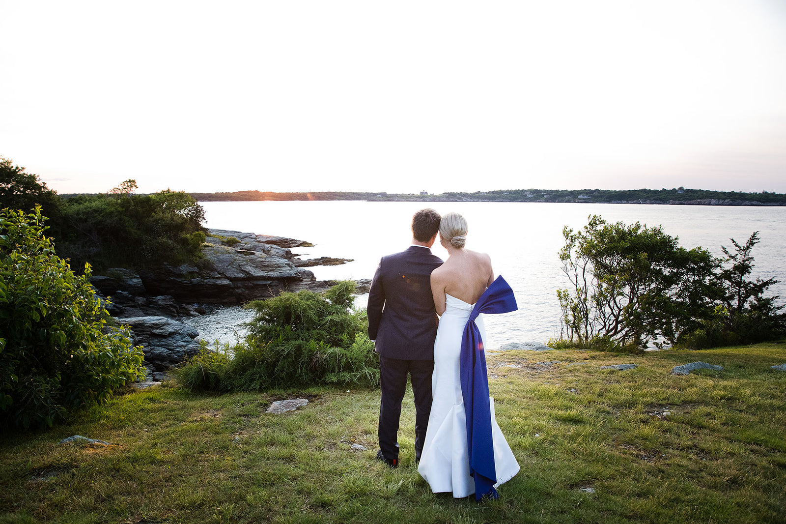 This Bride Wore A Carolina Herrera Dress with a Dramatic Blue Sash to Her Wedding at the Iconic Castle Hill Inn